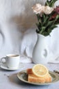 Lemon pound cake with slices of lemon and cup of coffee. Royalty Free Stock Photo