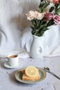 Lemon pound cake with slices of lemon and cup of coffee. Royalty Free Stock Photo