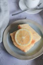 Lemon pound cake on vintage background. Close up slice of citrus pie by classic recipe. Royalty Free Stock Photo