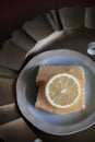 Lemon pound cake on vintage background. Close up slice of citrus pie by classic recipe. Royalty Free Stock Photo