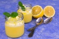 Lemon pudding on a blue background. Delicate lemon dessert.