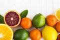 Lemon,red orange, orange, grapefruit, lime on old wooden table.