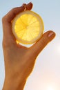 Lemon segment hand female sun