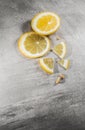 Lemon slice on gray table. Fresh citrous fruits piece, isolated with copyspace