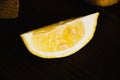 A lemon slice macro. Juicy tropical fruit on a dark background