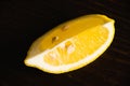 A lemon slice macro. Juicy tropical fruit on a dark background