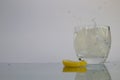 Lemon Slice Splashing in Ice Water Royalty Free Stock Photo