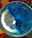 Lemon slice on the water with blue background