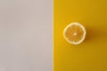 Lemon slice on yellow and white background Royalty Free Stock Photo