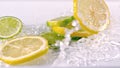 Lemon slices falling into water