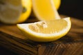 Lemon slices on a wooden cutting board, lemon macro. Juicy tropical fruit on a dark background