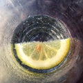 Lemon in soda water glass - slice of lemon in drinking glass Royalty Free Stock Photo