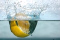 Lemon splash into water Royalty Free Stock Photo