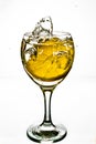 Lemon splashes in a water glass Royalty Free Stock Photo