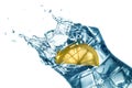 Lemon splashing into coctail glass closeup, isolated Royalty Free Stock Photo