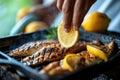 Lemon Squeeze on Grilled Fish: Enhancing grilled fish with a fresh lemon squeeze in a kitchen backdrop