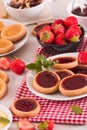 Lemon and straberry tartlets. Royalty Free Stock Photo