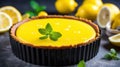 a lemon tart with lemons and mint leaves