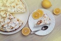 Lemon Tart with Meringue Caramelized Cream on plate on white wooden background and a piece of Tart with Lemon Fruits Royalty Free Stock Photo
