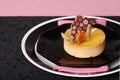 Lemon tart on pink and black Royalty Free Stock Photo