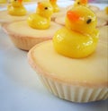 Duck shape dessert on lemon tart