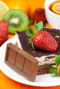 Lemon tea,chocolate, kiwi,cake and strawberries Royalty Free Stock Photo