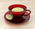 Lemon tea in cup and saucer with rind