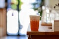 Lemon tea in plastic cup on counter bar table beside windows Royalty Free Stock Photo