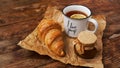 Lemon tea, home made jam, croissant on wooden table. Breakfast concept. Royalty Free Stock Photo