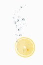 Lemon in water with air bubbles Royalty Free Stock Photo