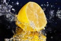 Lemon water with a big splash on blue background