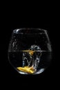 Lemon water splash in a glass with a black background Royalty Free Stock Photo