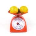Lemon in weight scale isolated Royalty Free Stock Photo