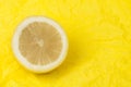 Lemon on a yellow background Royalty Free Stock Photo