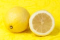 Lemon on a yellow background Royalty Free Stock Photo