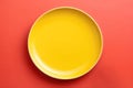 Lemon Yellow Monochrome Plate On Brick Red Background, Top View. Generative AI