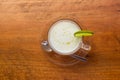 Lemon yogurt fresh milk in a clear glass placed on a brown wooden. Top view Royalty Free Stock Photo