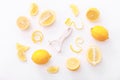 Lemon zest with zester on a white background. Top view