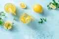 Lemonade on a blue background with copy space. Homemade fresh drink Royalty Free Stock Photo