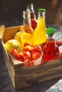 Lemonade with cherry, pear and lemon on the garden picnic