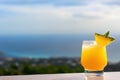 Lemonade cocktail on the beach close-up. Vacation background.