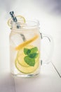 Lemonade Cocktail Mojito with Fresh Cold Ice, Lemon and Mint Leaves in Mason Jar Royalty Free Stock Photo
