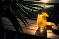 Lemonade cocktail with tropical fruits on the beach. Vacation background.