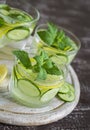 Lemonade with cucumber, lemon, mint and ginger in glass cups Royalty Free Stock Photo