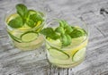 Lemonade with cucumber, lemon, mint and ginger in glass cups Royalty Free Stock Photo