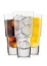 Lemonade drink with cola and orange soda with ice cubes on white background in luxury glasses Royalty Free Stock Photo