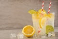 Lemonade. Drink with fresh lemons and limes. Summer mood, Lemon cocktail with juice and ice. Refreshing drink Royalty Free Stock Photo