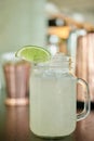 Lemonade drink in a mason jar on a bar counter