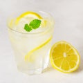 Lemonade Drink of Soda Water with Lemon and Fresh Mint in a Glass Tasty Healthy Summer Drink Gray Background Square Royalty Free Stock Photo