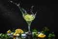 Lemonade with fresh lemon. fresh drink with liquid splash, freeze motion in jar glass on dark background Royalty Free Stock Photo